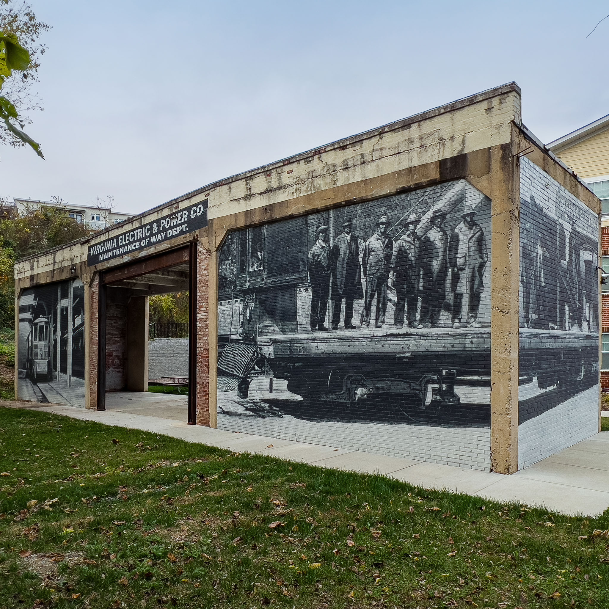 The story wraps. Each wall carries imagery on both faces, so the narrative continues as visitors move through the installation rather than ending at the primary viewing angle.